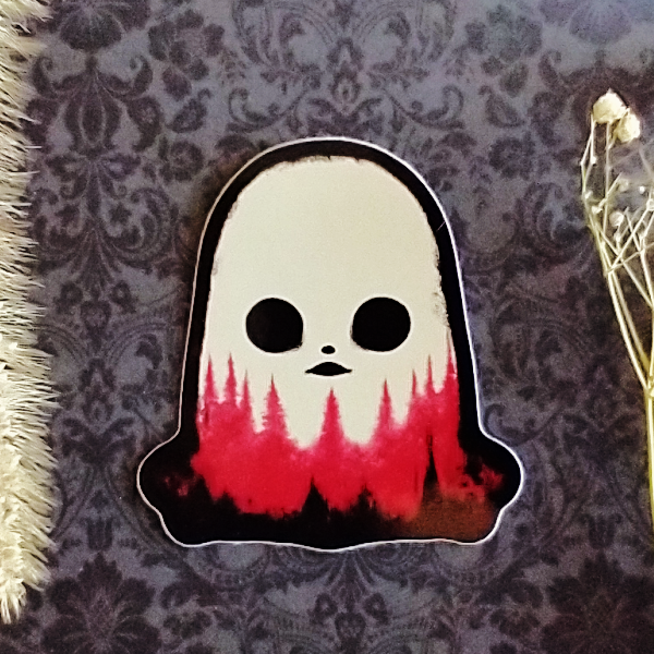 A black, white, and red sticker of a ghost with pine trees along the bottom. The ghost's mouth looks like a UFO.