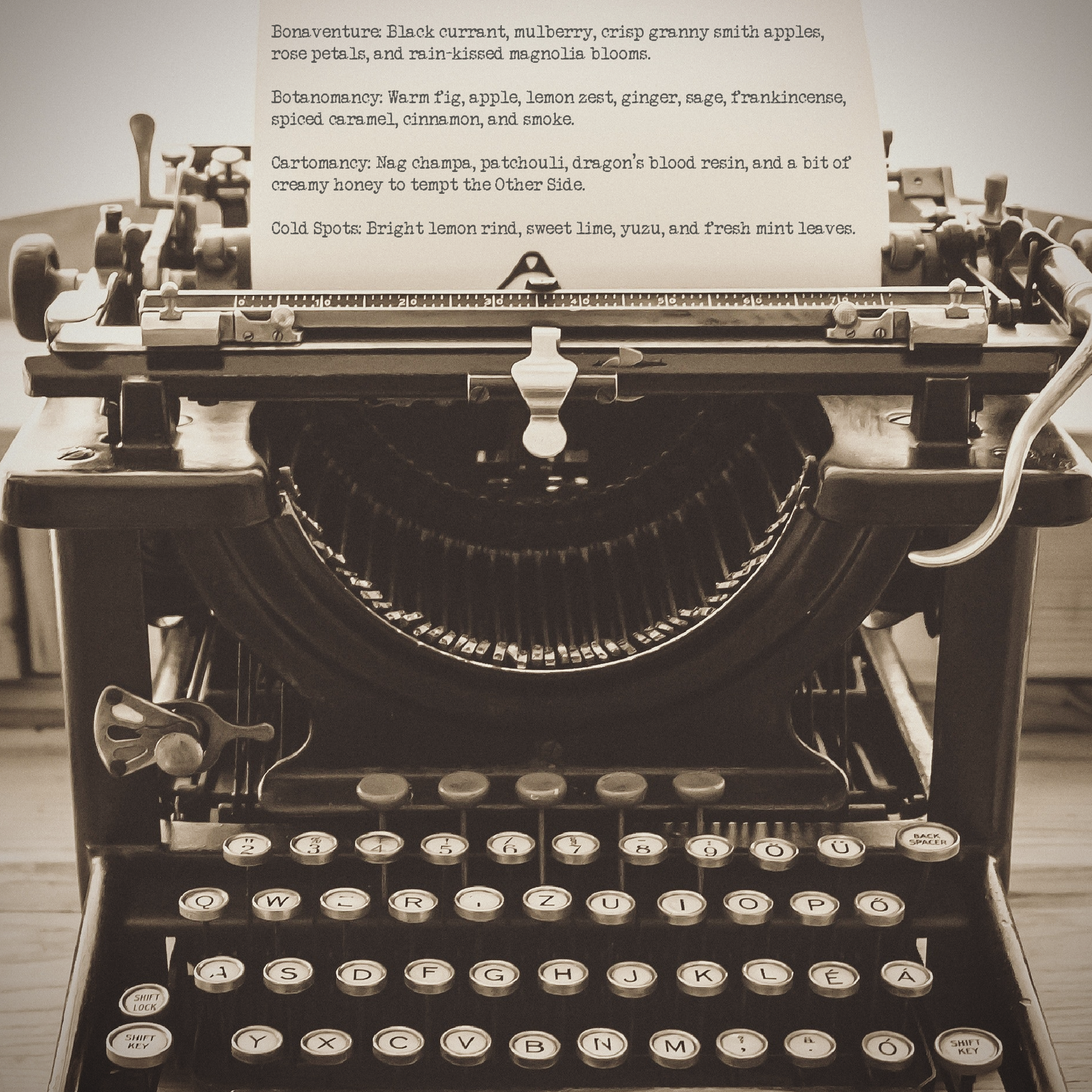 An antique typewriter with a piece of paper bearing several Little and Grim scent descriptions.